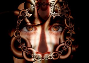 A woman's face in a circle of chains